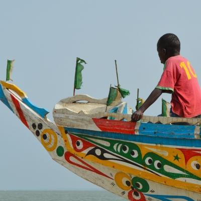 A colourful boat on the water in Senegal. As a Projects Abroad volunteer in Senegal there will be many memorable sights to behold.
